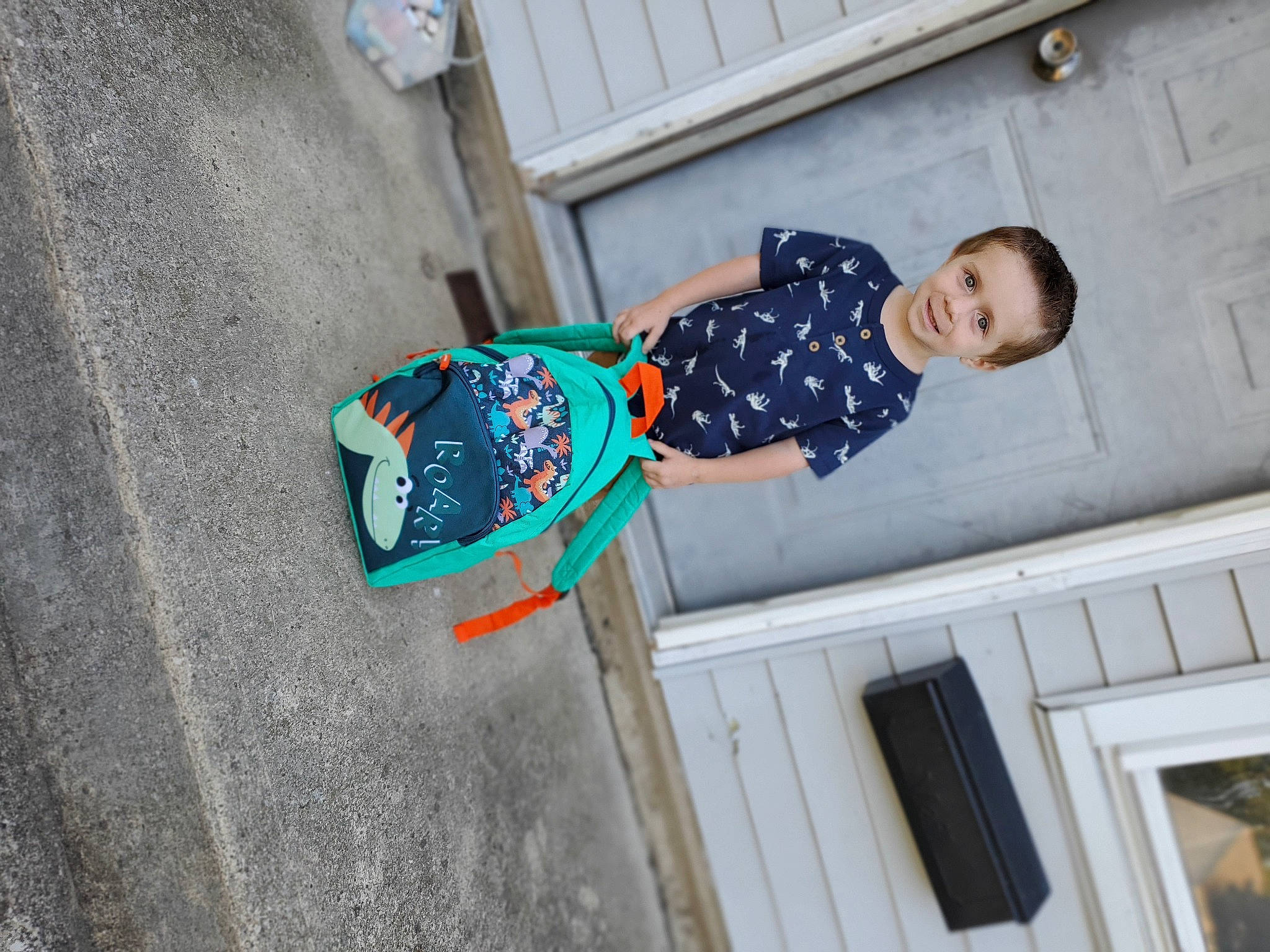 William is registered to the contest to win money with this photo: asphalt, azure, baby_toddler_clothing, blurred, child, concrete, fun, house, joy, leisure, pattern, person, room, sitting, smile, toddler, tree, window, winter