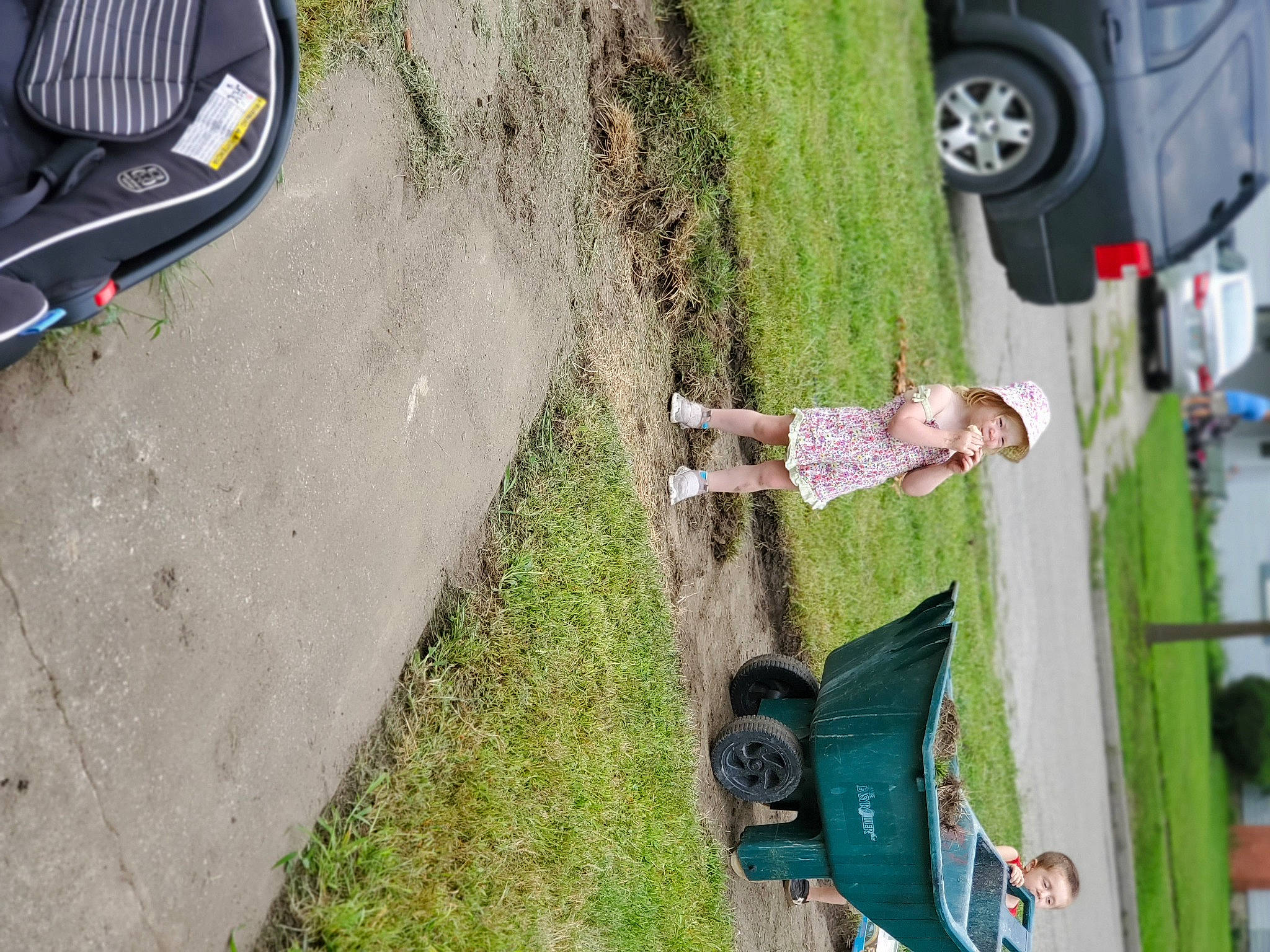 Kinley is registered to the contest to win money with this photo: asphalt, automotive_exterior, automotive_lighting, automotive_tire, car, fender, footwear, grass, green, mode_of_transport, motor_vehicle, person, plant, road_surface, shoe, sidewalk, tire, tree, vehicle, vehicle_door