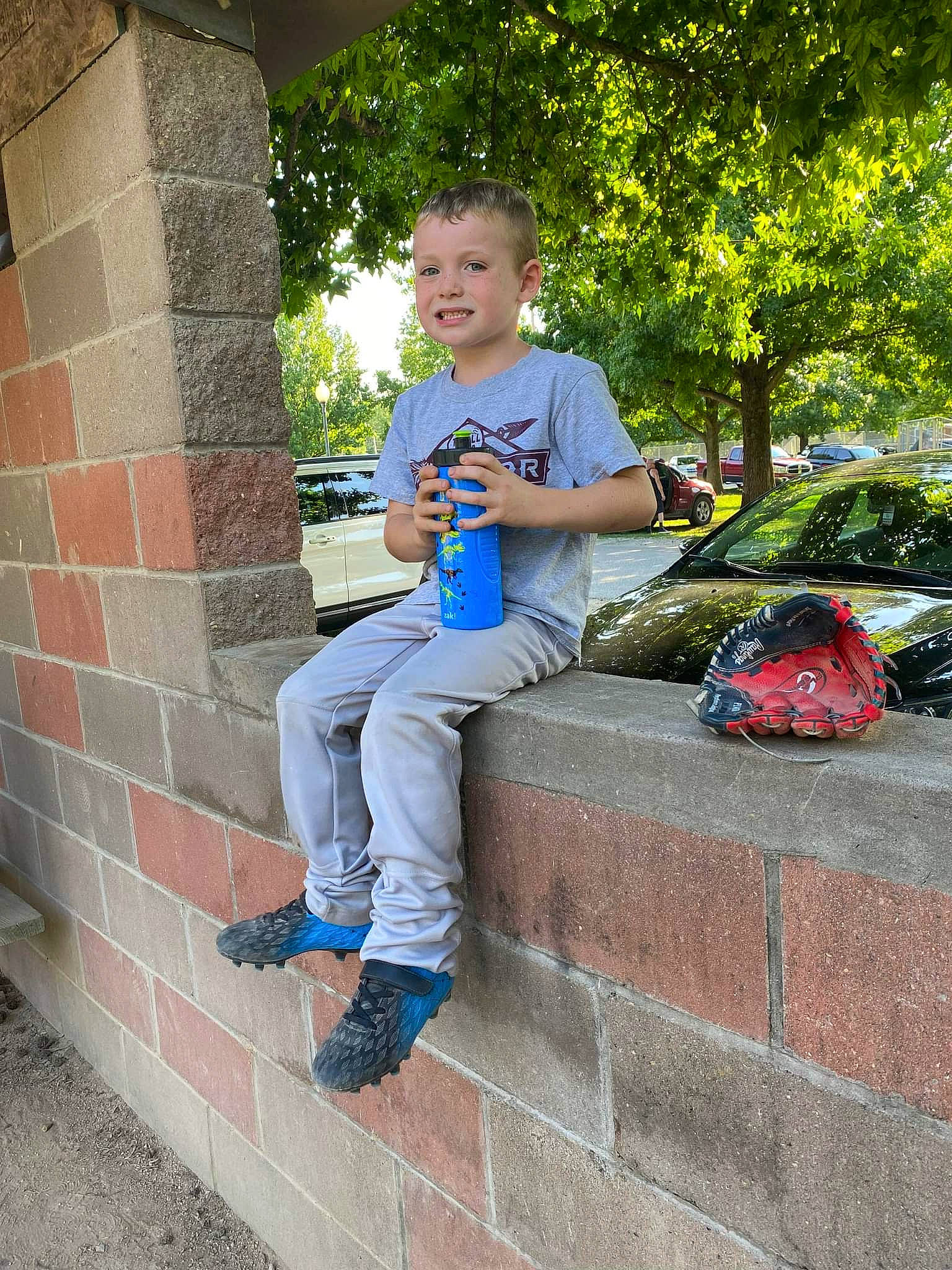 Quinton joined the competition — help win amazing prizes! brick, brickwork, child, denim, electric_blue, fun, grass, human_leg, knee, leg, leisure, person, plant, recreation, sidewalk, sitting, standing, t_shirt, thigh, toddler