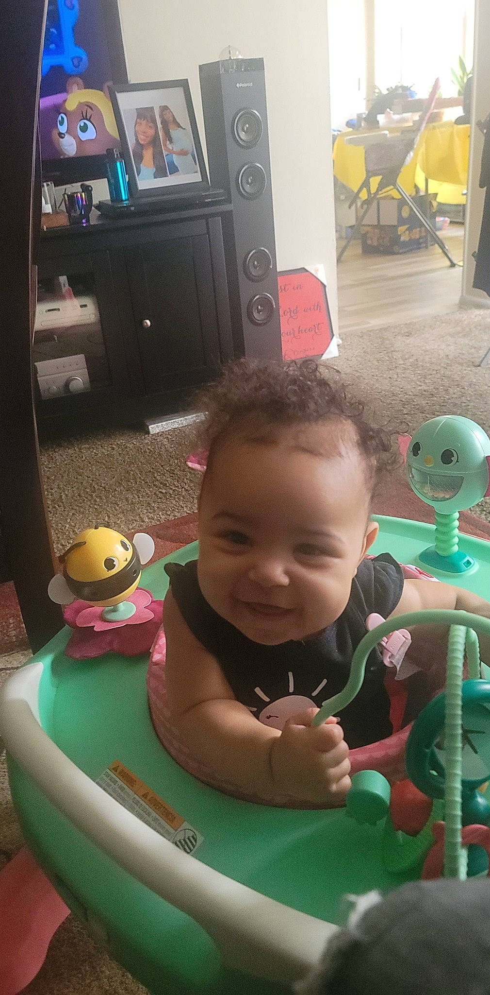 Anaiya joined the competition — help win amazing prizes! audio_equipment, baby, baby_products, baby_toys, chair, child, flooring, fun, happy, home_appliance, joy, leisure, person, play, recreation, room, sitting, smile, television, toddler