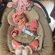 Nevaeh-Joan joined the competition — help win amazing prizes! baby, infant, baby_rocker, pink_clothing, headband, plush_toy, bunny_toy, indoor, wooden_floor, baby_seat, child, toy, room, colorful, safe, cute, soft_toys, face, person, home