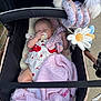 Nevaeh-Joan is registered to the contest to win money with this photo: baby, stroller, blanket, pacifier, toy, sleeping, infant, clothing, cute, pink, comfort, soft, outdoor, child, resting, baby_girl, warm, fabric, cushion, peaceful