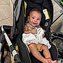Noah joined the competition — help win amazing prizes! baby, car_seat, smiling, indoor, laundromat, washing_machine, cloth, yellow_outfit, red_bracelet, happy, child, infant, cute, footwearless, seat, black, fabric, floor, tiled_floor, person
