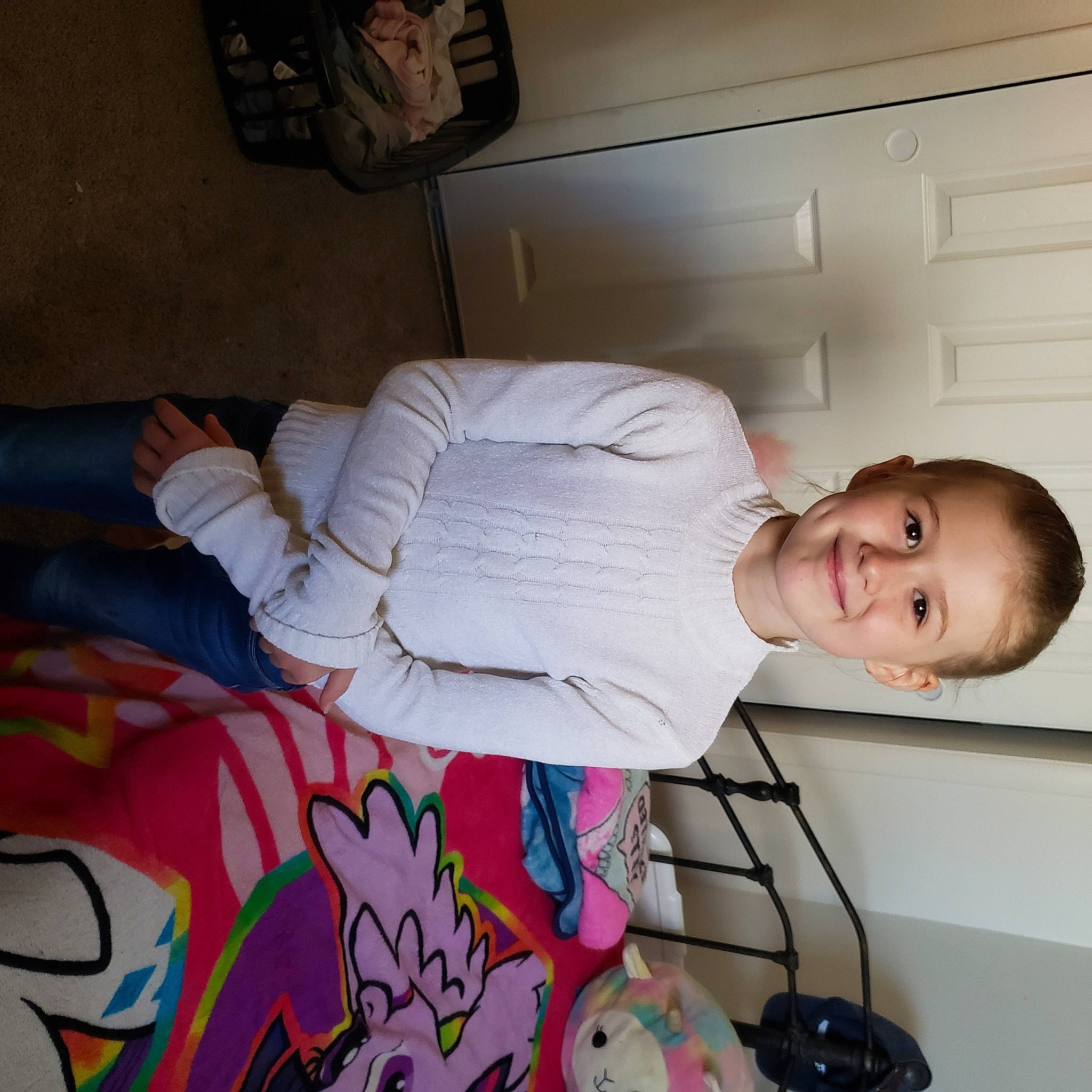 Karissa is registered to the contest to win money with this photo: baby, baby_products, bed, child, comfort, elbow, flooring, fun, joy, linens, mouth, person, room, smile, t_shirt, textile, toddler, toy, vertebrate