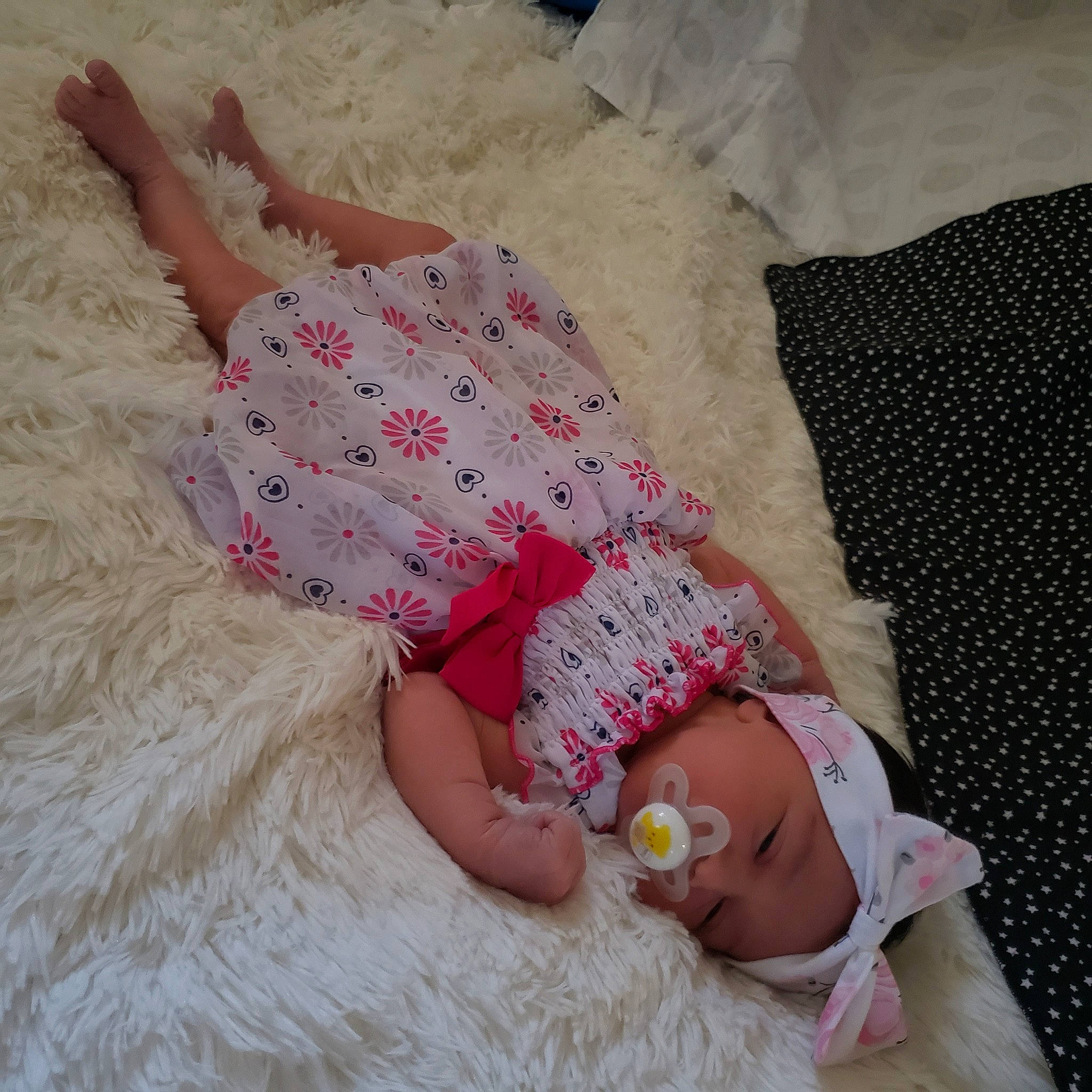 Asteria is registered to the contest to win money with this photo: baby, baby_sleeping, baby_toddler_clothing, comfort, dress, fawn, finger, hat, headgear, headwear, leg, linens, nail, pattern, person, pink, skin, sleeve, textile, thigh