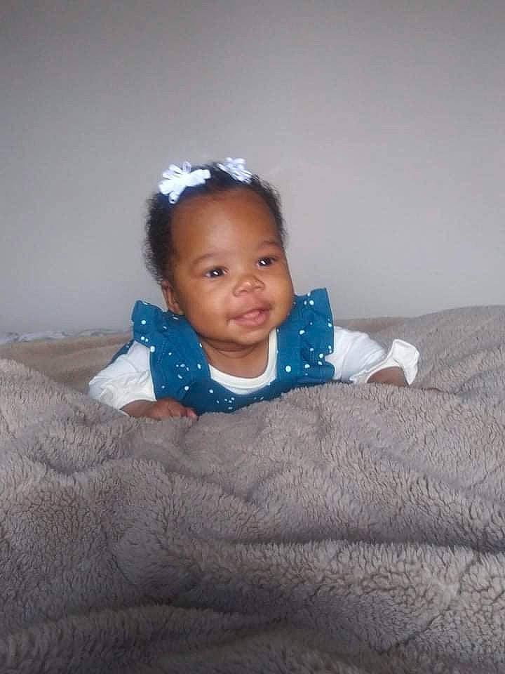 Zola Kimberlynn joined the competition — help win amazing prizes! baby, baby_toddler_clothing, cheek, child, comfort, electric_blue, eye, flash_photography, flooring, fun, happy, head, iris, linens, nose, person, room, sitting, sleeve, smile