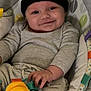 Bohdi joined the competition — help win amazing prizes! baby, infant, smile, face, hat, nike, clothing, onesie, baby_seat, toy, blanket, hand, comfort, cushion, indoor, cute, child, portrait, happy, soft_toys