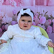 Valentina participe au concours pour gagner de l'argent avec cette photo : baby, child, white_dress, headband, chair, pink_backdrop, castle, flowers, portrait, sitting, cute, indoor, decor, person, happy, fashion, toddler, costume, celebration, smile