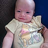 Harley joined the competition — help win amazing prizes! baby, infant, smile, winnie_the_pooh, yellow_shirt, child, cute, portrait, clothing, happy, face, arm, hand, background, fabric, blue, brown, texture, person, indoors