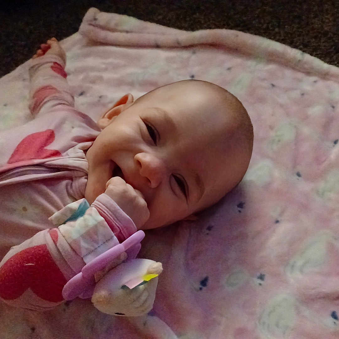 Saige joined the competition — help win amazing prizes! baby, bed, blanket, bodypart, clothing, crib, face, finger, furniture, hand, happy, head, infantbed, knitwear, newborn, person, photography, portrait, quilt, smile