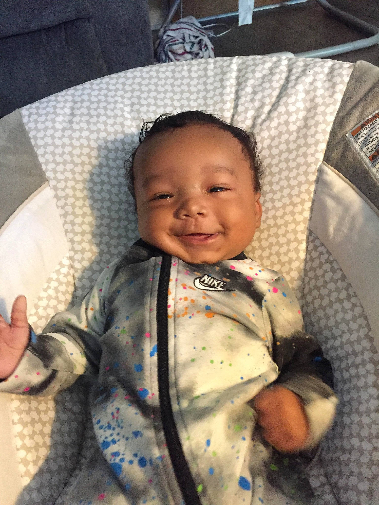 Karter is registered to the contest to win money with this photo: baby, baby_products, baby_toddler_clothing, car_seat, chair, cheek, child, comfort, face, finger, fun, happy, head, person, room, sitting, skin, sleeve, smile, toddler