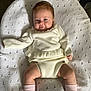 Larosa joined the competition — help win amazing prizes! baby, infant, child, white_outfit, pink_socks, white_shoes, blanket, knit_texture, cute, smiling, face, legs, hands, indoor, soft_lighting, portrait, resting, cozy, comfortable, young