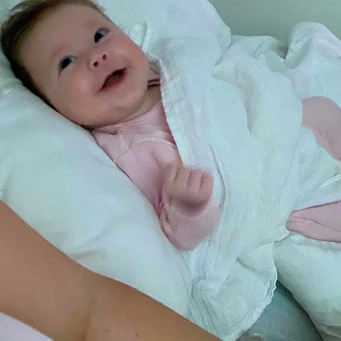 Larosa is registered to the contest to win money with this photo: arm, baby, blanket, child, comfort, cozy, cute, face, happy, indoors, infant, lying_down, newborn, person, pillow, resting, sleepwear, smile, soft, warm