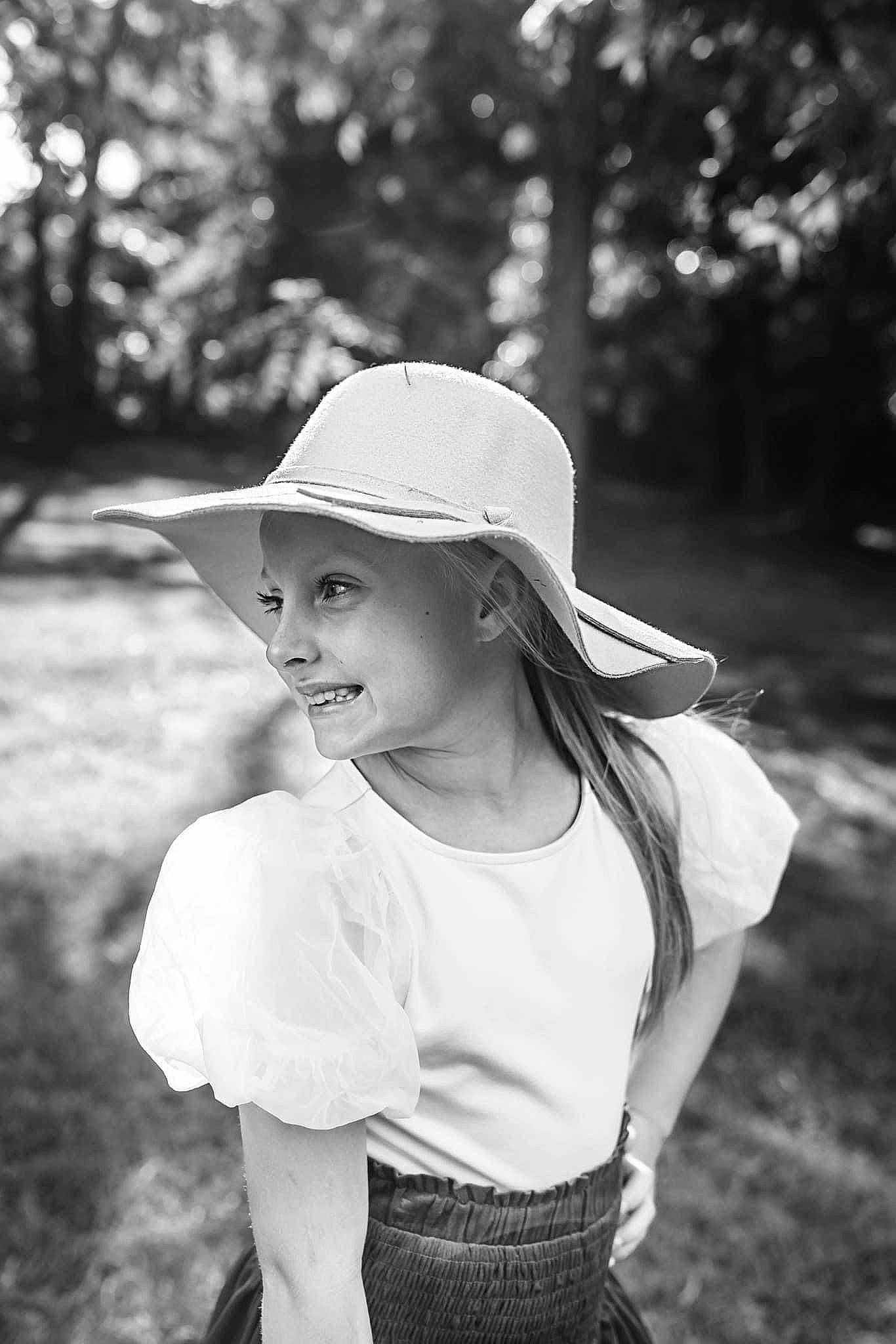 Korbynn joined the competition — help win amazing prizes! black, black_and_white, cap, flash_photography, grass, happy, hat, headgear, headwear, joy, monochrome, monochrome_photography, people_in_nature, person, plant, shoulder, sleeve, smile, style, sunlight