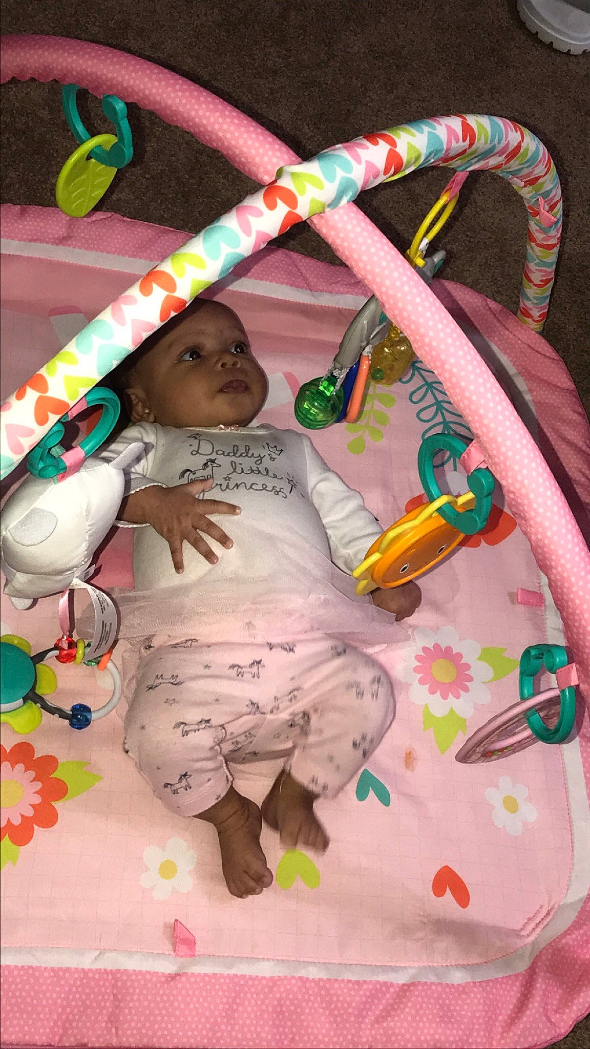 Khloe is registered to the contest to win money with this photo: baby, baby_products, baby_toys, child, headwear, linens, person, pink, product, toddler, toy