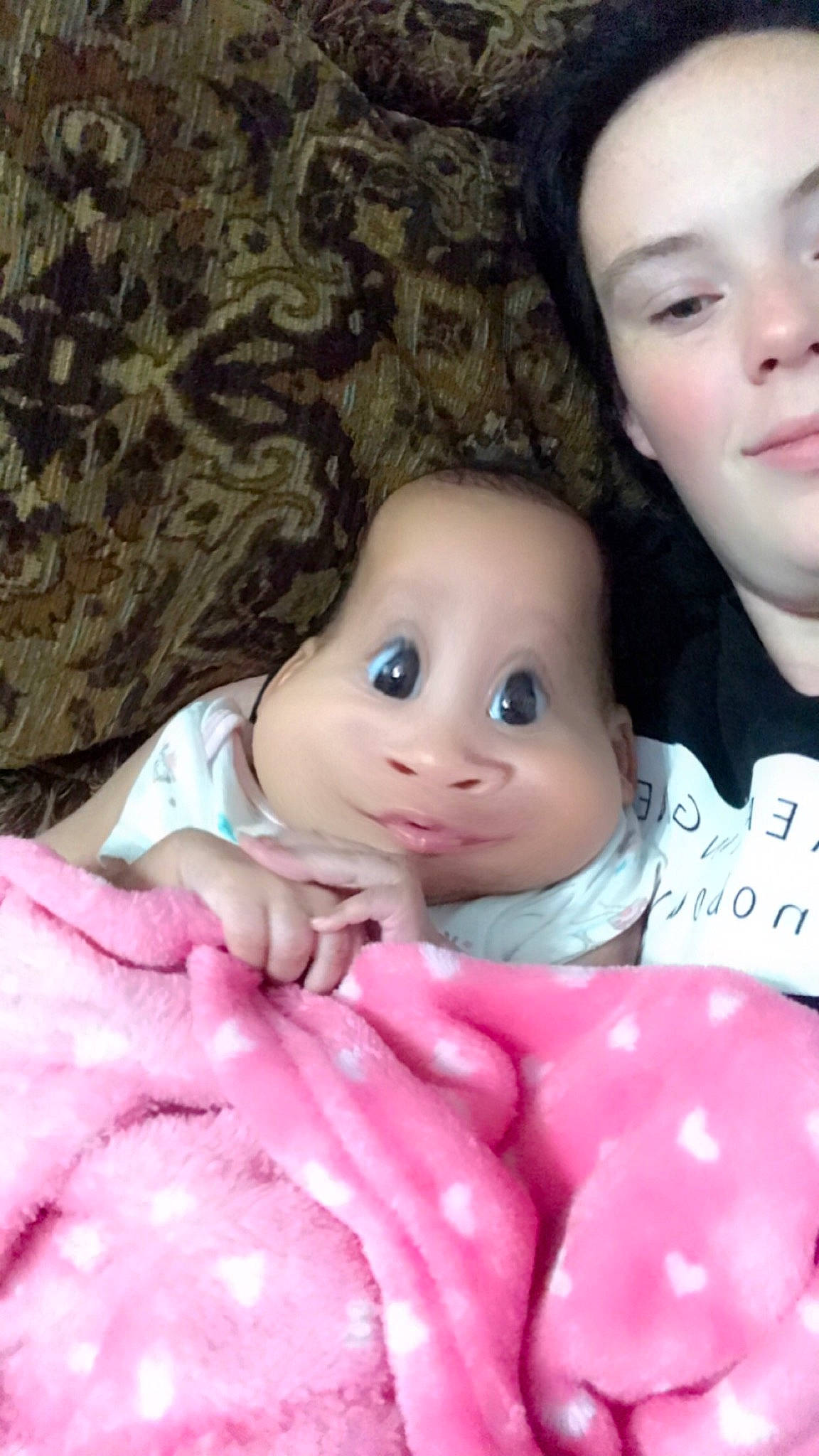 Khloe is registered to the contest to win money with this photo: baby, cheek, child, doll, face, head, lip, mouth, nose, person, pink, skin, smile, toddler, toy