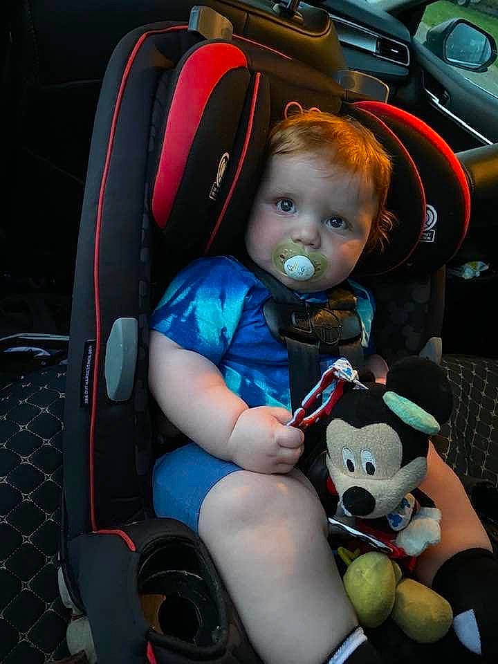 Calvin is registered to the contest to win money with this photo: auto_part, automotive_design, baby_carriage, baby_products, baby_toddler_clothing, car_seat, car_seat_cover, comfort, electric_blue, fun, lap, mode_of_transport, motor_vehicle, person, steering_wheel, thigh, tire, toddler, toy, vehicle_door