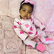 Surayah joined the competition — help win amazing prizes! baby, infant, child, pink, blanket, headband, bow, onesie, strawberry_pattern, soft_texture, cozy, portrait, sitting, eyes, face, footie_pajamas, cute, fabric, indoors, adorable