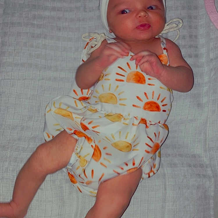 Zariah joined the competition — help win amazing prizes! baby, bed, blanket, bonnet, cap, clothing, diaper, dress, face, furniture, hat, head, homedecor, newborn, person, photography, portrait, quilt, sitting, sleeping