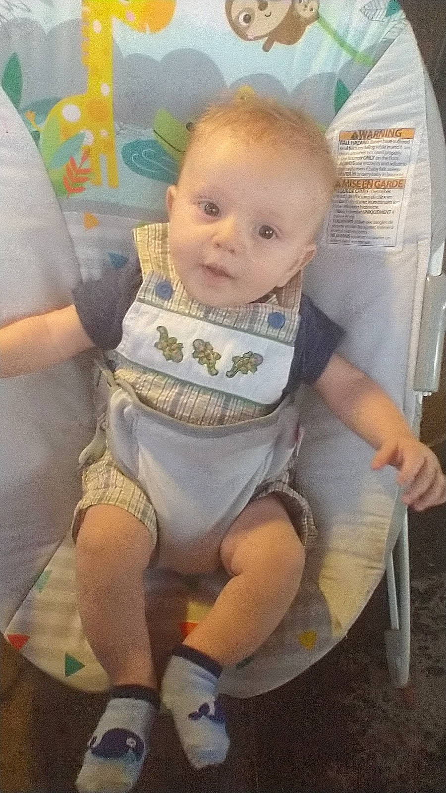 Joseph is registered to the contest to win money with this photo: baby, baby_products, baby_toddler_clothing, chair, cheek, child, comfort, fun, happy, human_leg, iris, lap, mouth, person, sandal, sitting, skin, thigh, tire, toddler