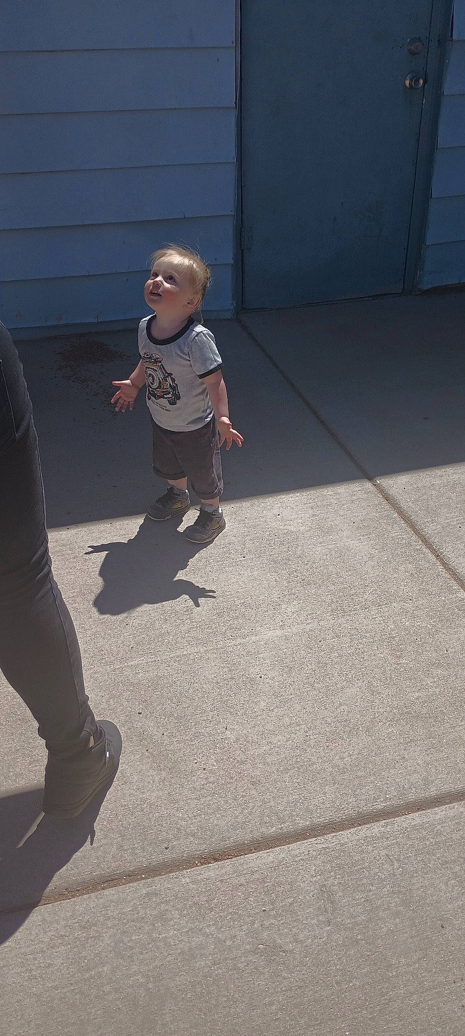 Joseph joined the competition — help win amazing prizes! asphalt, child, concrete, floor, flooring, foot, grass, human_leg, leg, leisure, pedestrian, person, recreation, road, road_surface, shadow, sidewalk, sitting, tints_and_shades, toddler