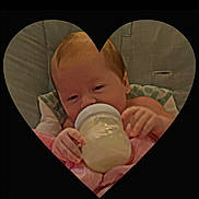 Bentley joined the competition — help win amazing prizes! baby, blanket, bottle, child, close_up, comfort, cushion, cute, face, feeding, hand, heart_shape, indoors, infant, milk, portrait, resting, sleepy, soft_texture, young