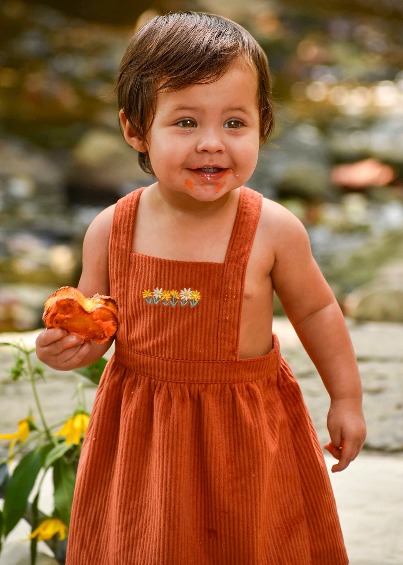 Iris is registered to the contest to win money with this photo: bodypart, child, clothing, dress, face, female, finger, flower, flowerarrangement, flowerbouquet, girl, hand, happy, head, person, petal, photography, plant, portrait, smile