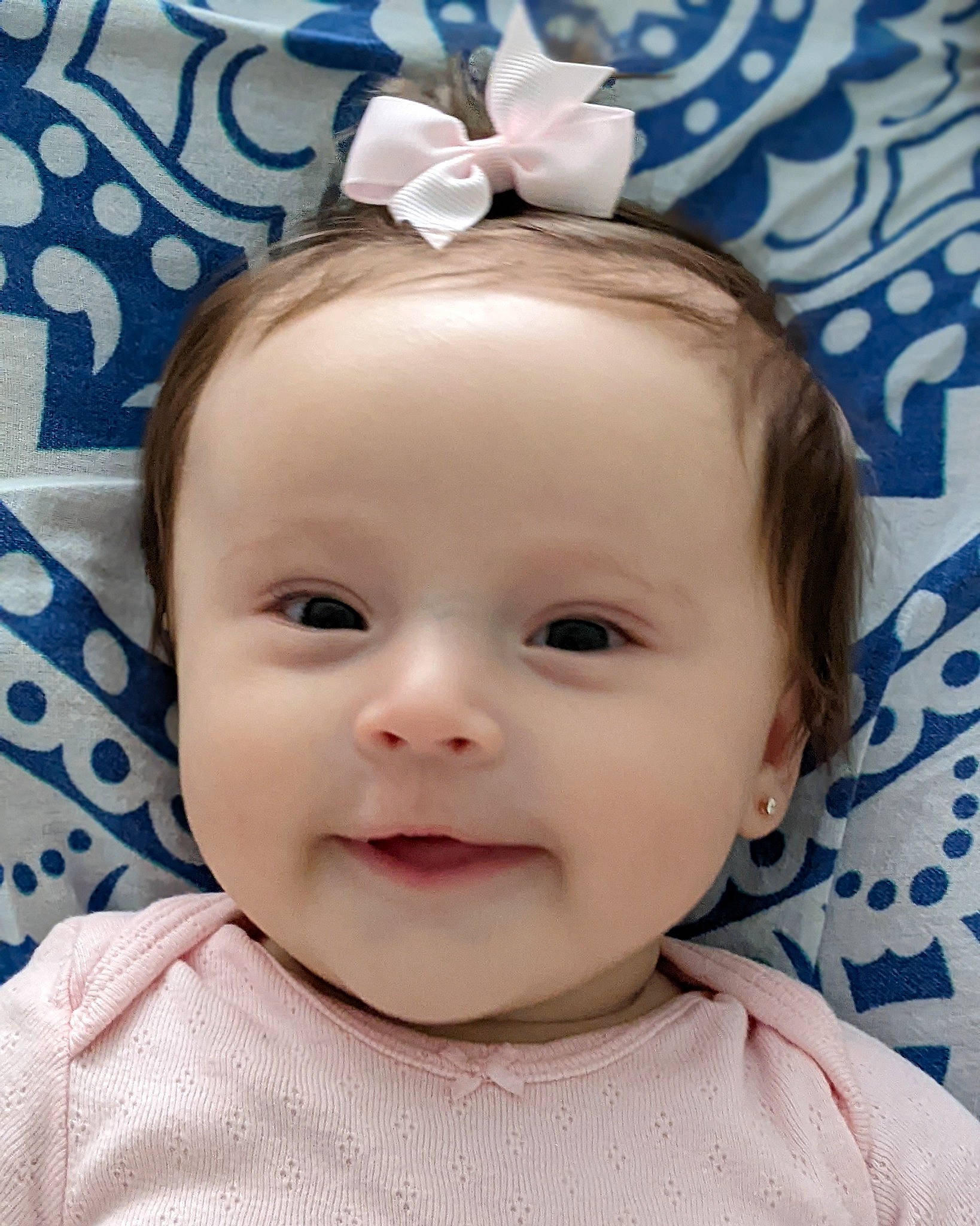Carmela is registered to the contest to win money with this photo: baby, baby_toddler_clothing, blue, cheek, chin, ear, eye, eyebrow, eyelash, face, happy, head, iris, joy, lip, person, pink, skin, sleeve, smile
