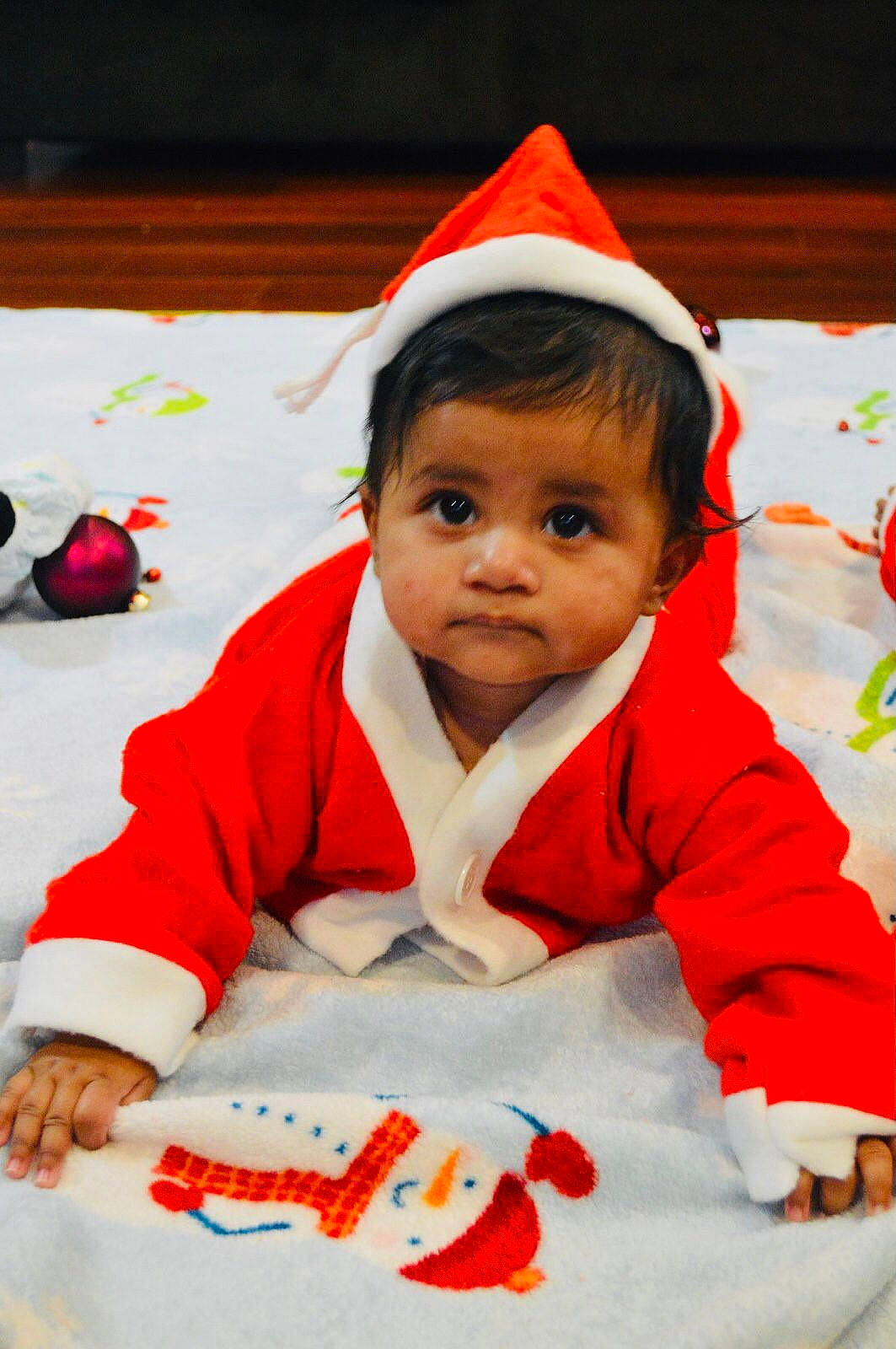 Alaina joined the competition — help win amazing prizes! arm, baby, cheek, eye, face, facial_expression, fun, happy, head, headgear, human_body, jacket, mouth, nose, outerwear, person, red, skin, sleeve, smile