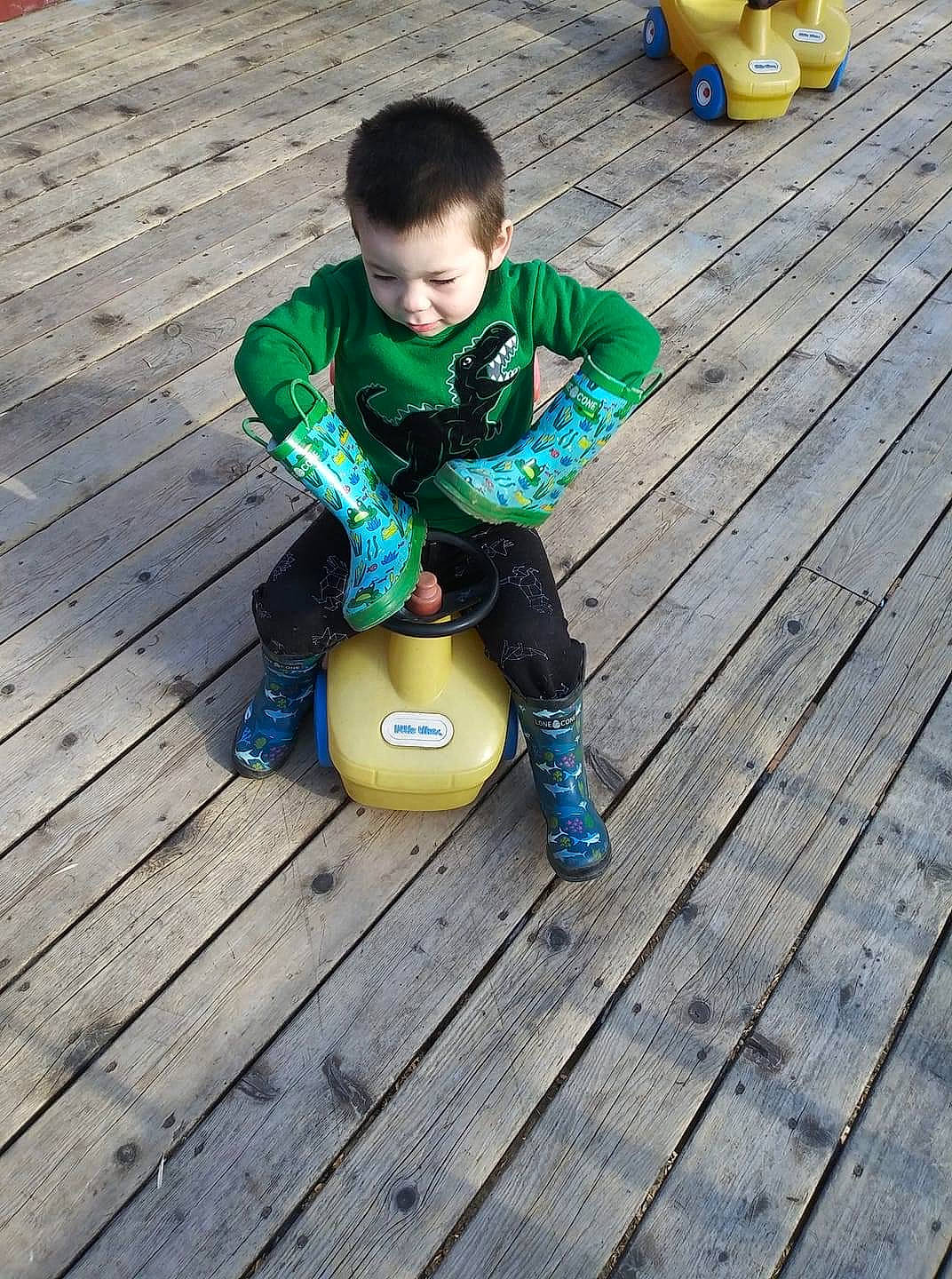 Jaxyn is registered to the contest to win money with this photo: ball, child, person, play, recreation, sitting, toddler, yellow