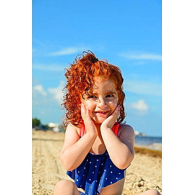 Kylie is registered to the contest to win money with this photo: azure, beach, blond, body_of_water, brown_hair, cloud, electric_blue, fun, happy, joy, leisure, long_hair, people_in_nature, people_on_beach, person, sky, smile, surfer_hair, swimwear, thigh