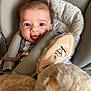 baby, car_seat, child, closeup, comfort, cuddly, cute, fabric, face, hair, happy, indoors, infant, playful, plush_toy, portrait, seatbelt, smiling, soft, stuffed_animal