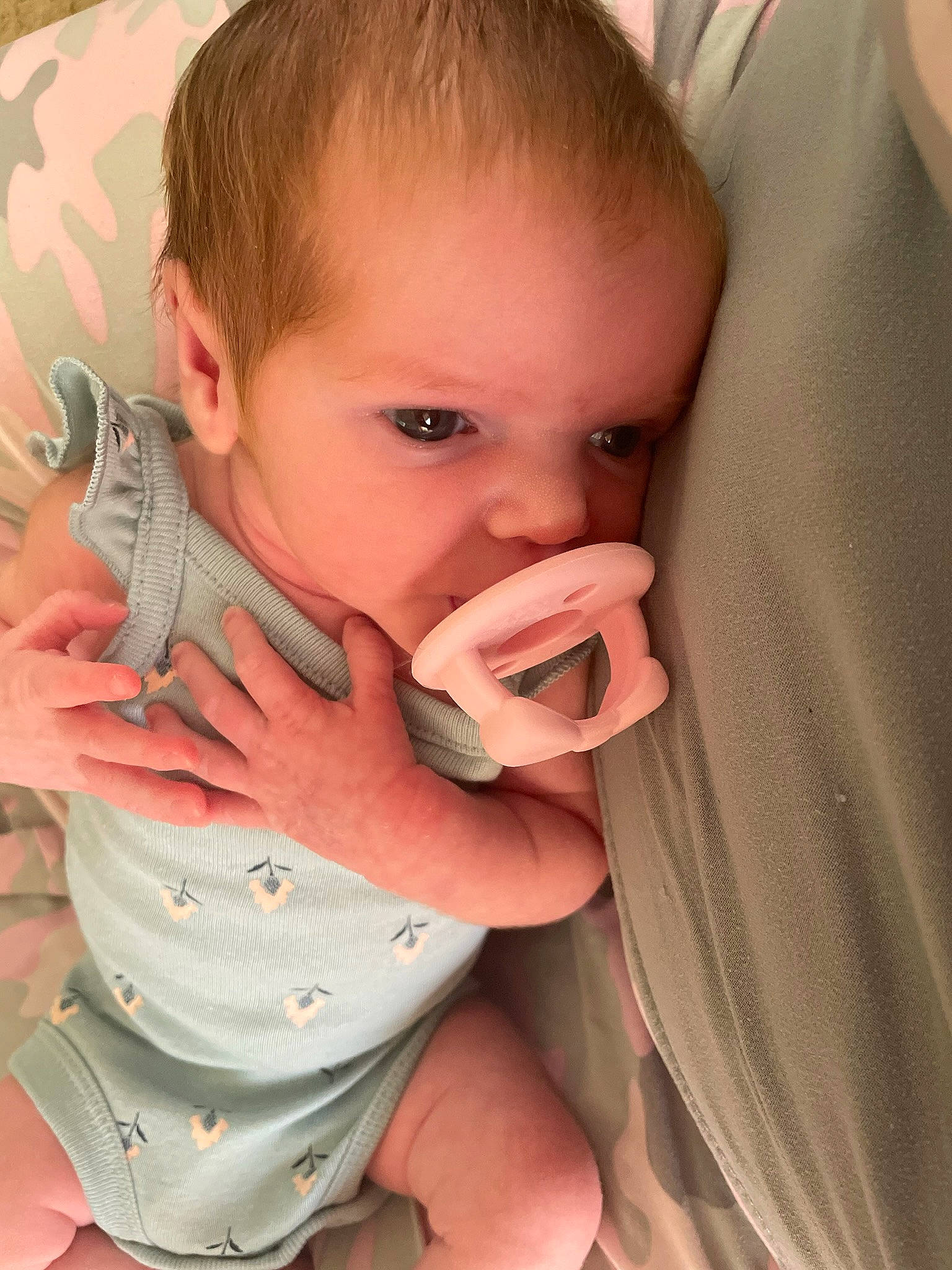 Chloe is registered to the contest to win money with this photo: baby, baby_toddler_clothing, cheek, comfort, ear, eye, eyebrow, eyelash, finger, gesture, hand, iris, lip, mouth, neck, nose, person, skin, sleeve, thumb