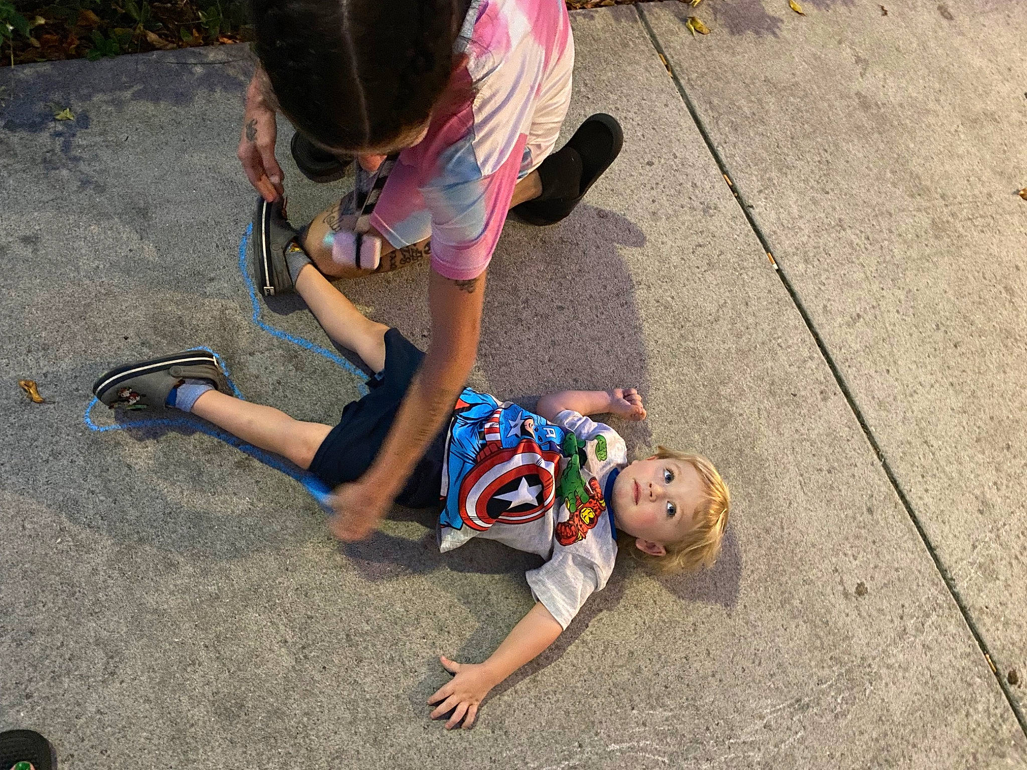 Kol joined the competition — help win amazing prizes! asphalt, barefoot, child, flooring, foot, fun, grass, human_leg, leg, leisure, mammal, person, road, road_surface, sandal, shadow, shorts, sidewalk, sitting, toddler