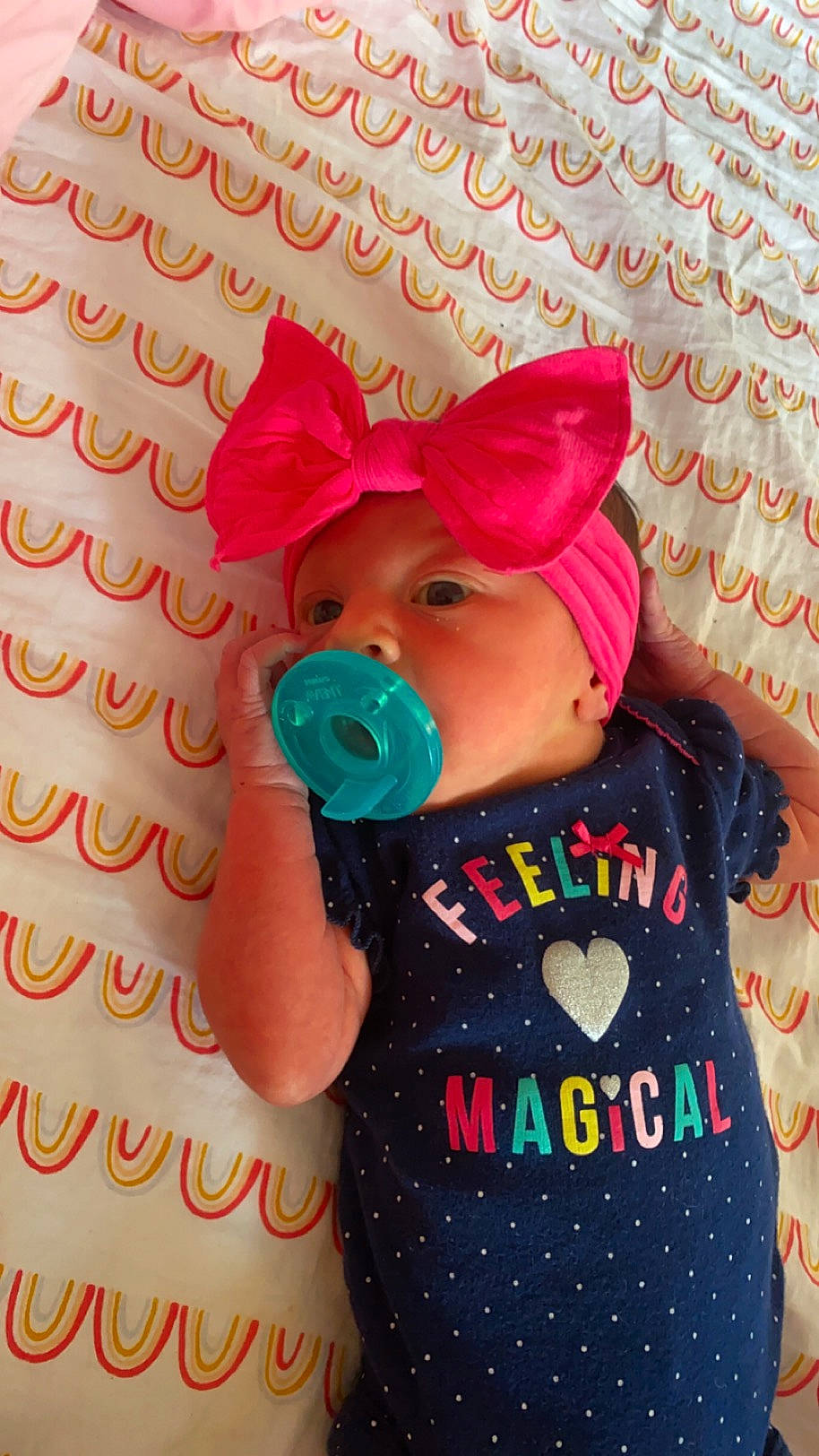 Amelia is registered to the contest to win money with this photo: baby_products, baby_toddler_clothing, baby_toys, cap, costume_hat, design, font, happy, headgear, headwear, linens, magenta, party_supply, pattern, peach, person, pink, plush, sleeve, stuffed_toy
