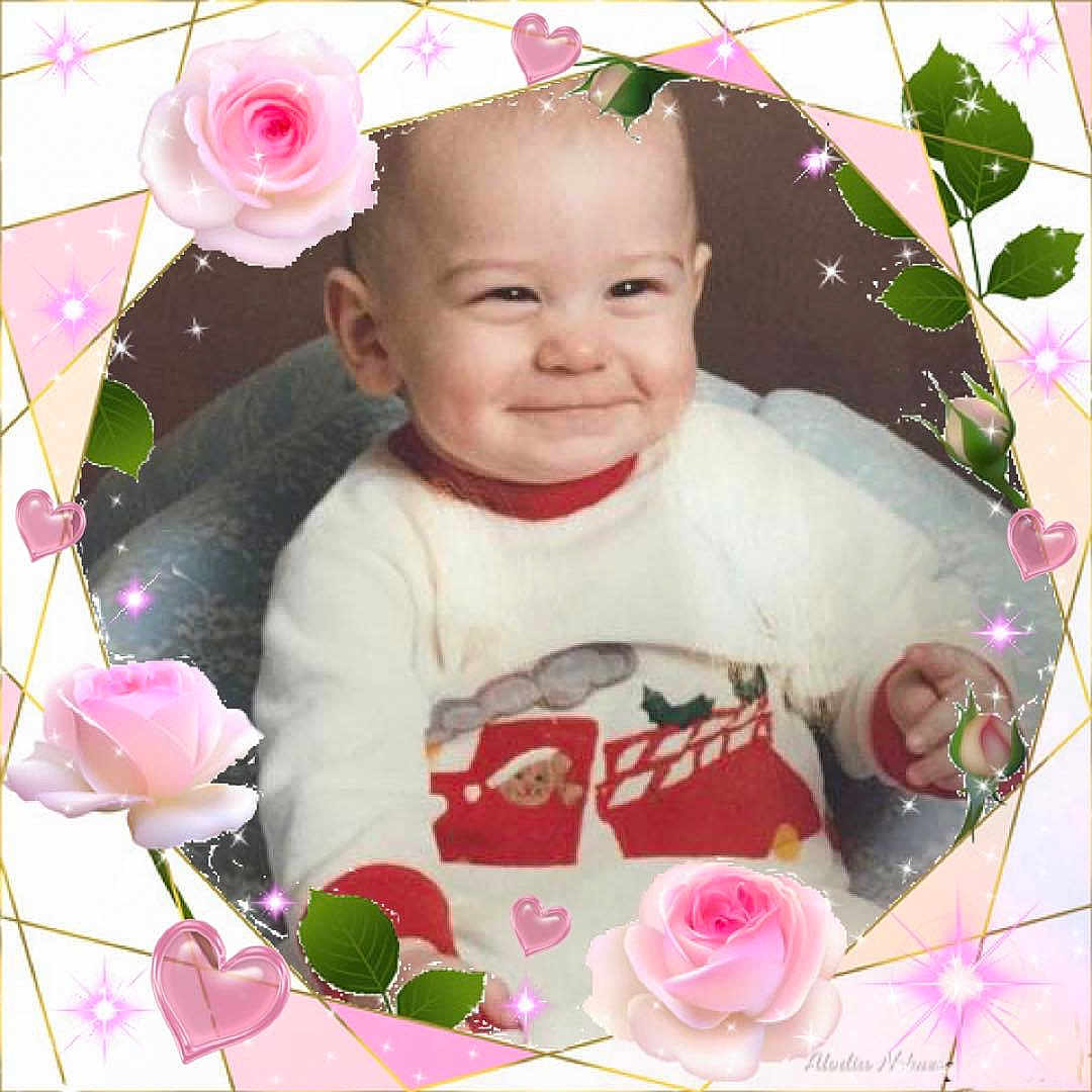 Michael joined the competition — help win amazing prizes! baby, smile, face, child, sweater, heart, rose, flower, sparkle, frame, pink, cute, holiday, cozy, indoors, portrait, cheeky, expression, person, background