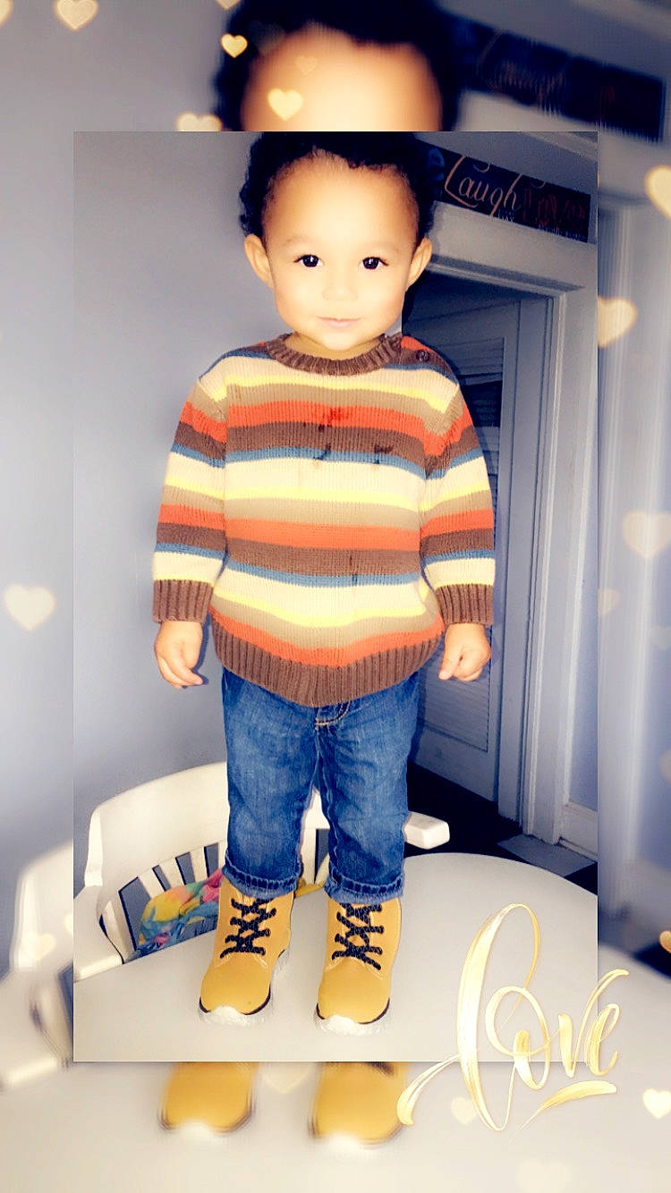 Braiden is registered to the contest to win money with this photo: cheek, child, cool, denim, doll, footwear, head, jeans, person, shoe, standing, t_shirt, toddler, toy, trousers