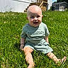 baby, bald, bracelet, child, daylight, footwear_bare, grass, green_clothing, happy, house, outdoor, person, portrait, shorts, sitting, smiling, stairs, sunny, tshirt, yard