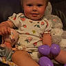 baby, child, clothing, cute, doll, face, foot, happy, indoor, infant, leather_chair, person, plush_toy, portrait, purple_eggs, sitting, smiling, stuffed_animal, toy, young_child