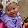 baby, child, cute, face, gravel_path, happy, hat, hoodie, knit_hat, outdoor, person, pink_car, playtime, pom_poms, purple_hoodie, smiling, steering_wheel, toddler, toy_car, yellow_button