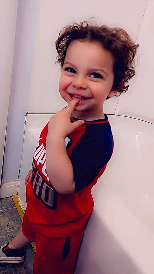 Josiah is registered to the contest to win money with this photo: arm, baby, cheek, child, chin, face, facial_expression, forehead, gesture, happy, joy, lip, mouth, nose, person, shoulder, skin, smile, standing, toddler