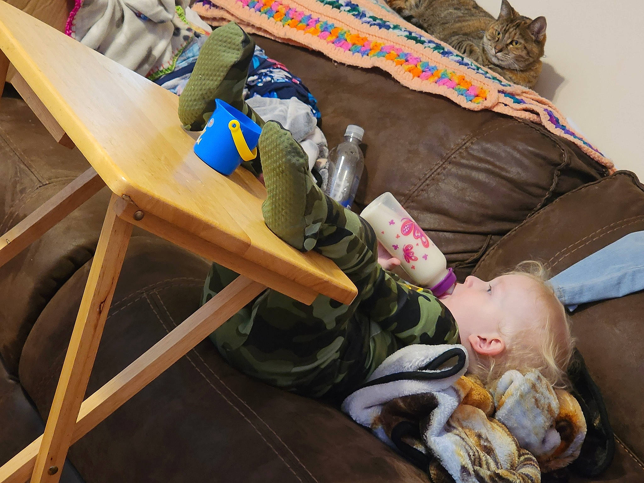 Allastor joined the competition — help win amazing prizes! baby, bag, comfort, couch, linens, lumber, nap, outdoor_furniture, person, plastic, room, sitting, table, toddler, toy, wood