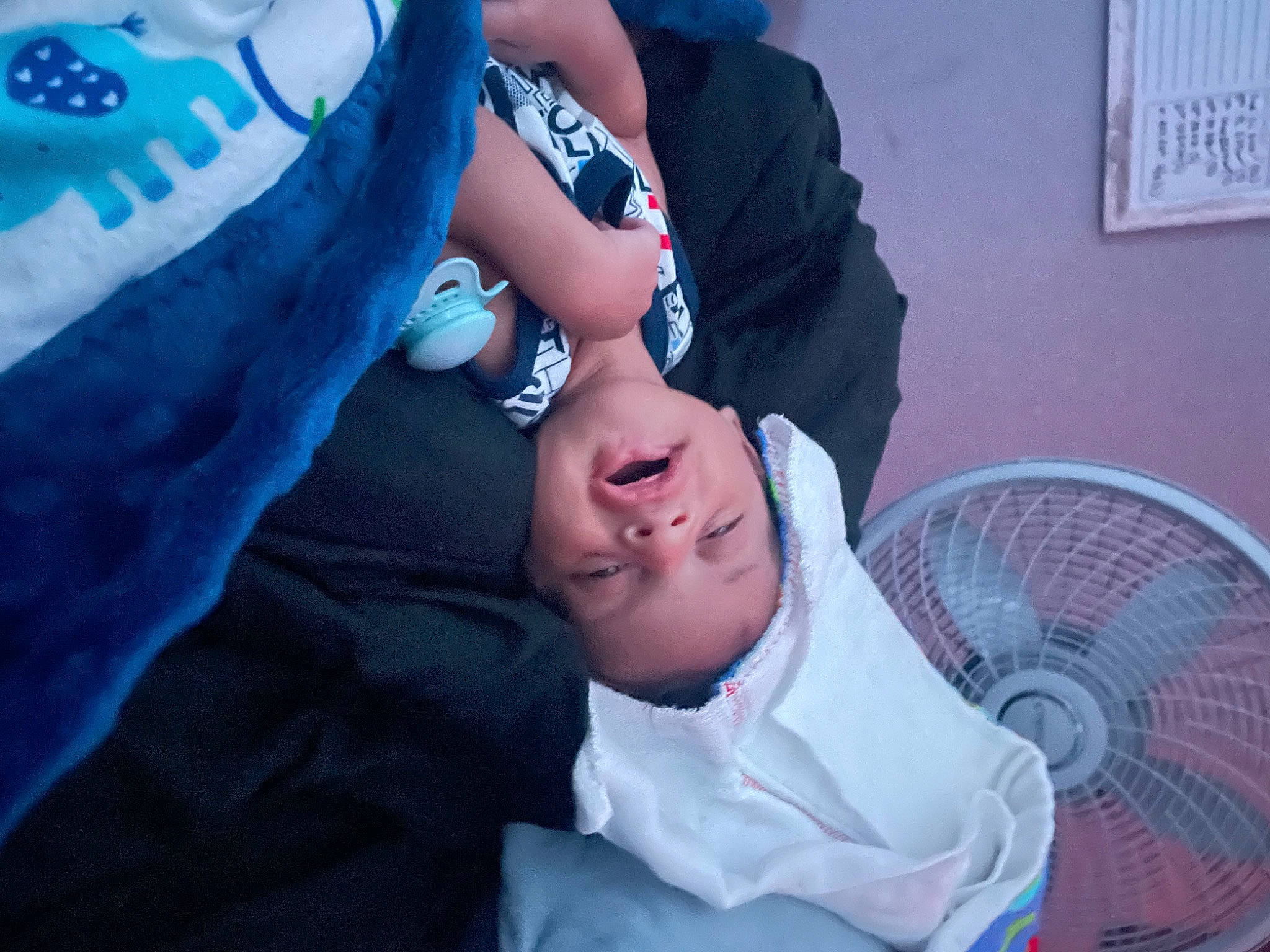 Apollo is registered to the contest to win money with this photo: blue, chair, child, comfort, cool, electric_blue, eyewear, fashion_accessory, flash_photography, fun, gesture, happy, hat, headpiece, linens, love, mouth, person, purple, romance