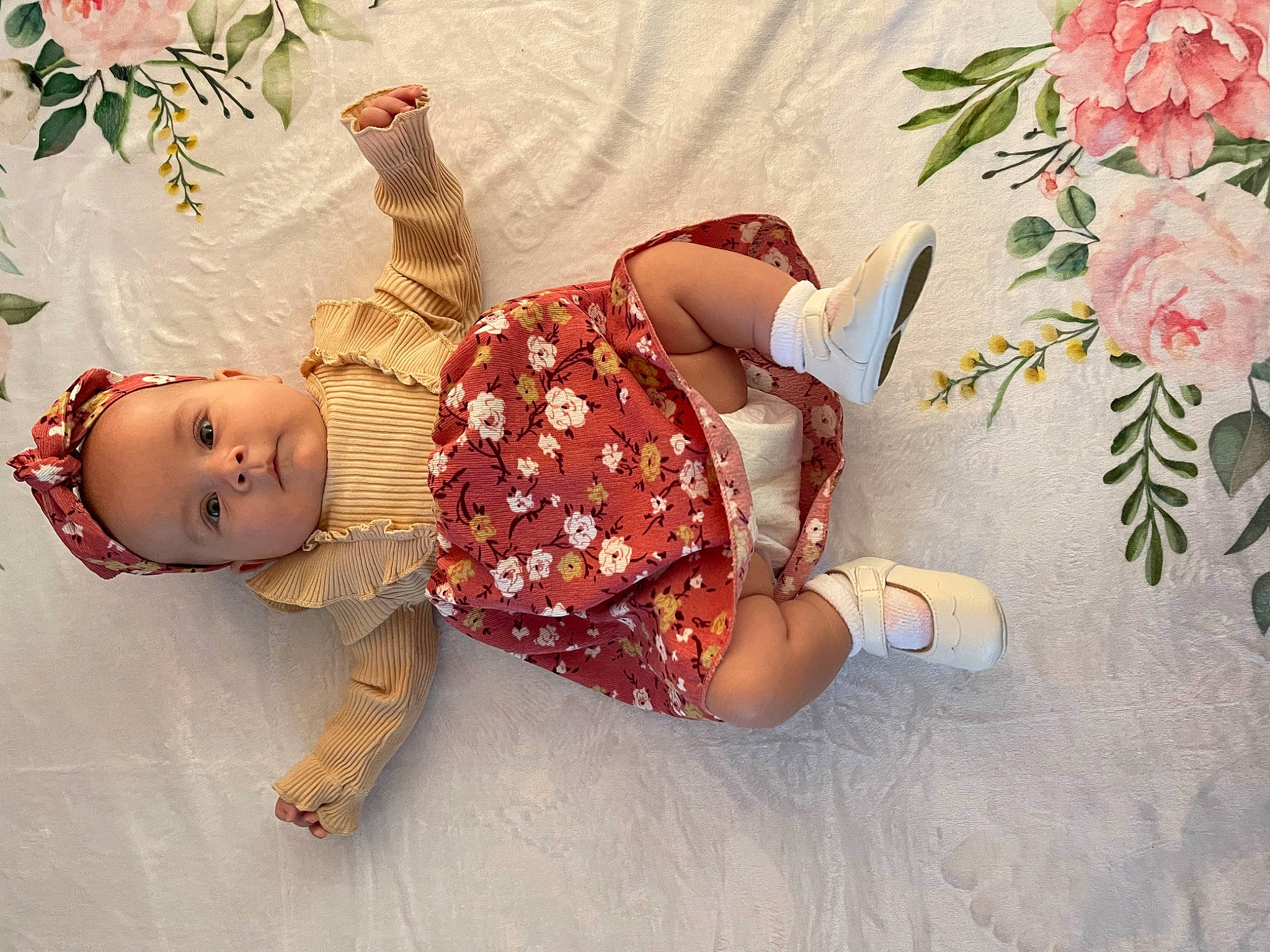 Elayna is registered to the contest to win money with this photo: baby, baby_toddler_clothing, child, doll, fashion_accessory, fawn, flower, happy, human_leg, linens, pattern, peach, person, petal, pink, plant, rose, skin, textile, toddler