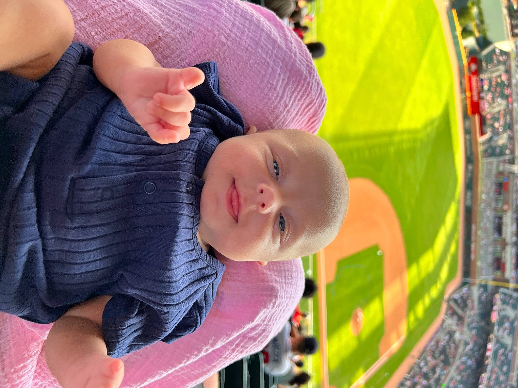 Marlee is registered to the contest to win money with this photo: baby, baby_products, child, finger, fun, gesture, grass, hand, happy, hat, leisure, pattern, person, play, recreation, sitting, skin, smile, thumb, toddler