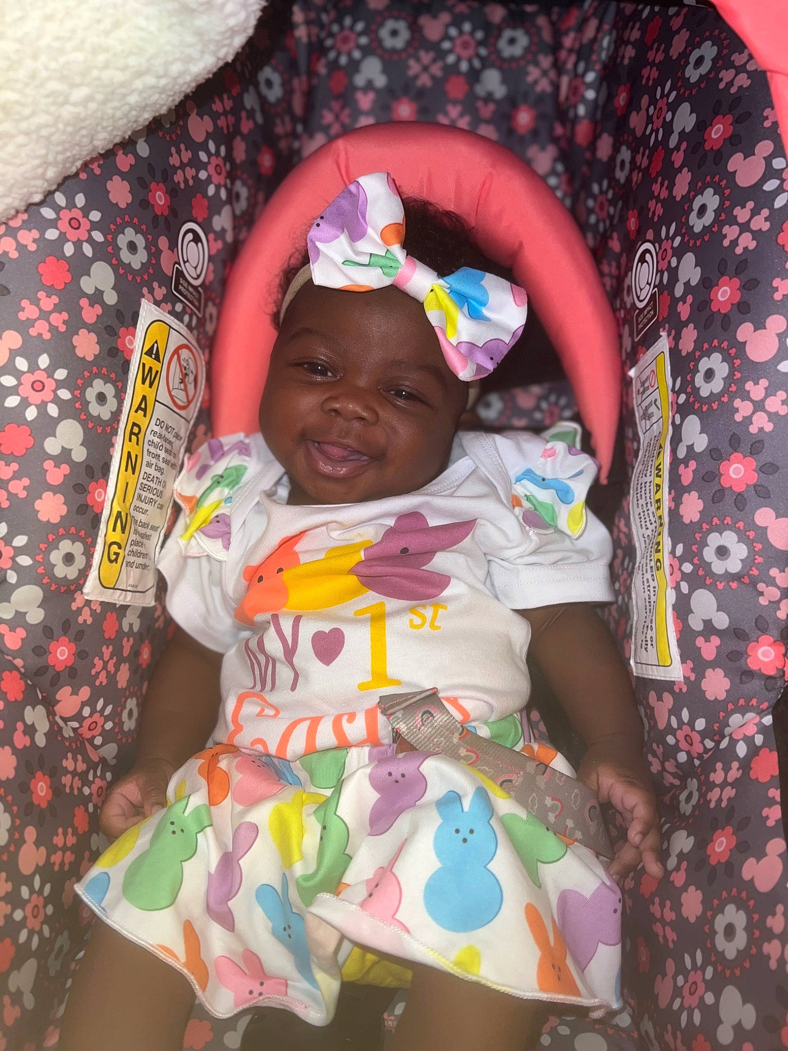 Noelani is registered to the contest to win money with this photo: baby, baby_toddler_clothing, cheek, child, comfort, finger, fun, happy, hat, headwear, human_body, mouth, organ, people, person, pink, skin, sleeve, smile, t_shirt