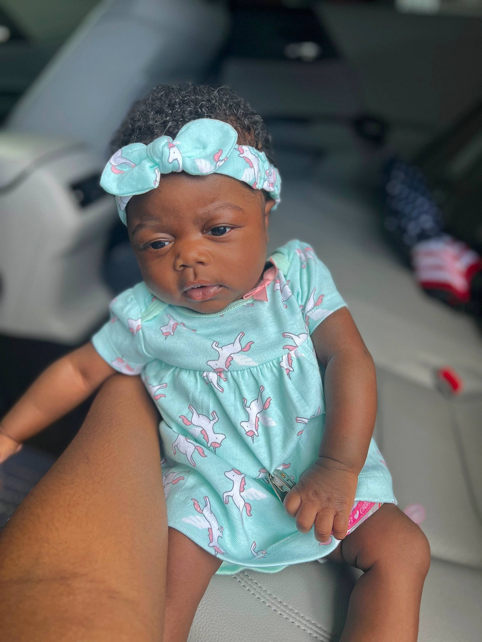 Noelani is registered to the contest to win money with this photo: arm, baby, baby_toddler_clothing, cap, child, flash_photography, fun, hairstyle, happy, hat, headwear, human_leg, iris, leisure, organ, person, pink, purple, skin, thigh