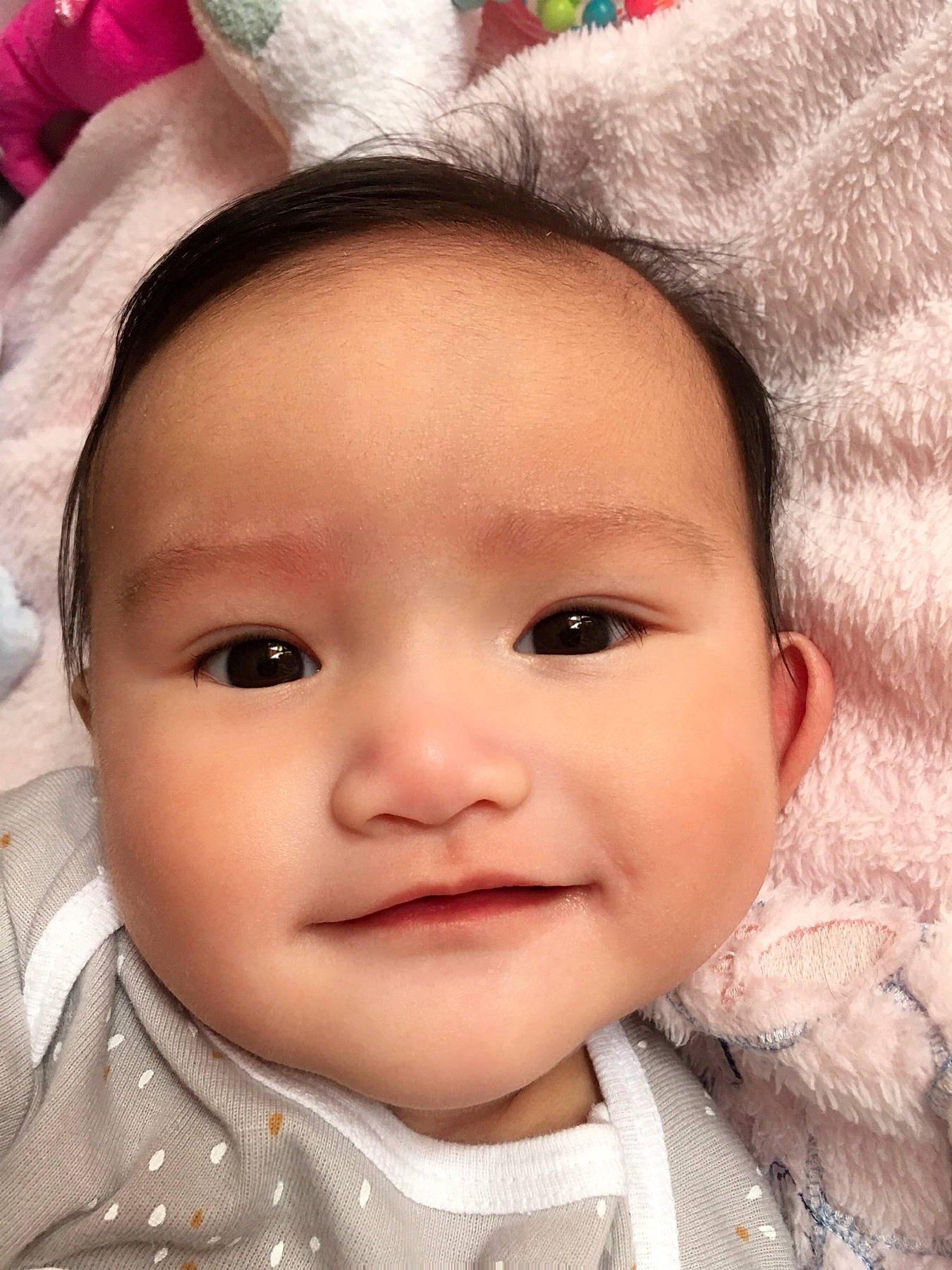 Aubrielle is registered to the contest to win money with this photo: baby, cheek, chin, ear, eye, eyebrow, eyelash, face, hairstyle, happy, head, iris, joy, lip, nose, person, pink, skin, smile, textile