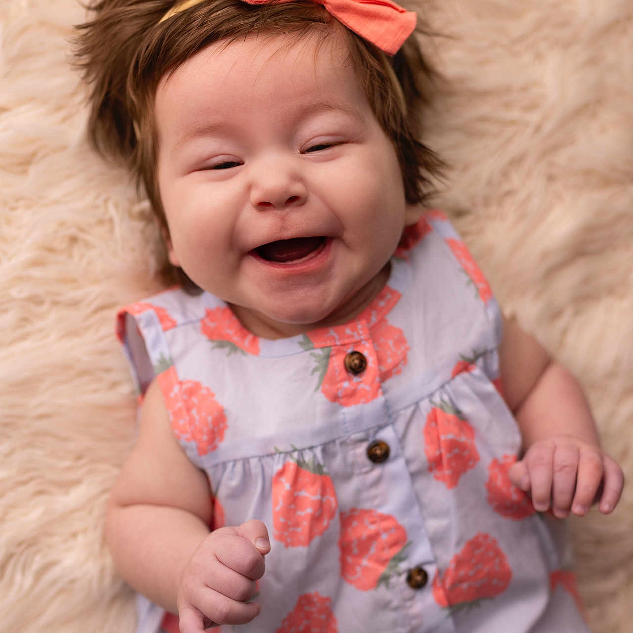 Autumn joined the competition — help win amazing prizes! arm, baby, button, child, clothing, cute, dress, face, fur_rug, hand, happy, headband, human, infant, lying_down, pattern, portrait, skin, smiling, strawberry