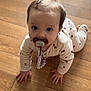 Eléa a rejoint le concours — aidez-le/la à gagner de superbes lots ! child, infant, baby, pacifier, crawling, hardwood_floor, onesie, hair_clip, pajamas, hands, eyes, face, indoor, floorboard, looking_up, closeup, cute, home, portrait, toy_chain